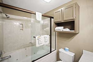 Jetted tub, hair dryer, towels
