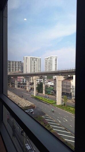 A view of a multi-level parking garage with a bridge overhead. - 35 Bow Hotel (Bangkok)