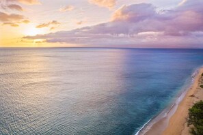 A beach with a clear view of the ocean and a sandy shoreline. - SUMMER SALE! 3BR Condo w Sweeping Ocean Views Near the Beach - Kaanapali Plantation 32 (Lahaina)