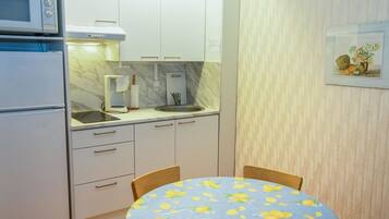 Fridge, microwave, cookware/dishes/utensils