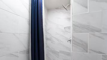 Shower, towels, soap, toilet paper