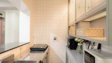 Fridge, microwave, cookware/dishes/utensils