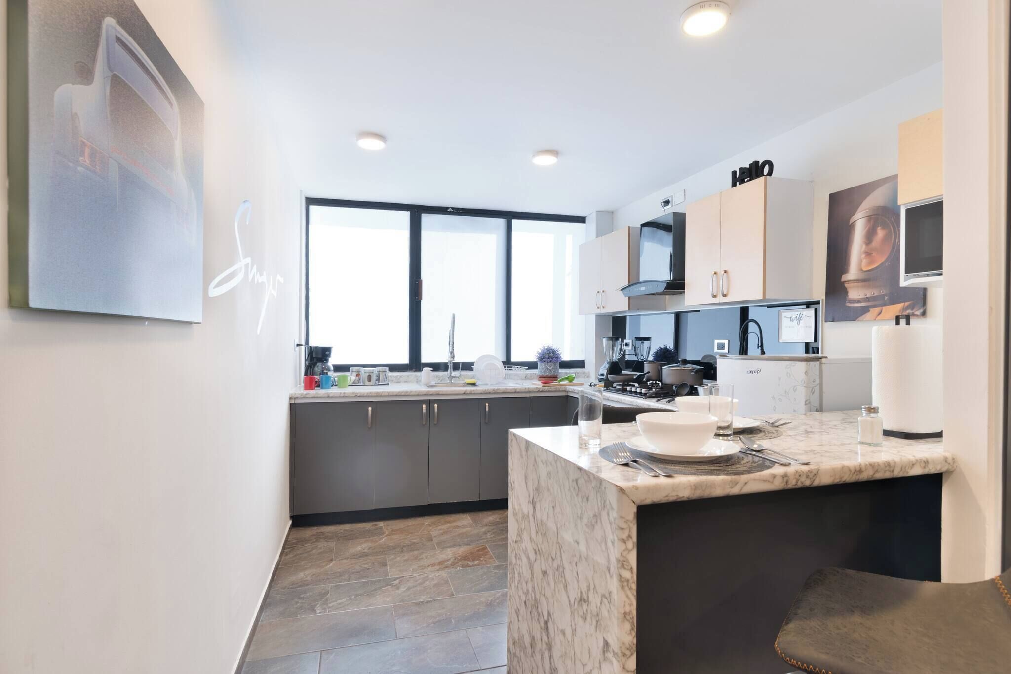 Fridge, stovetop, dishwasher, coffee/tea maker