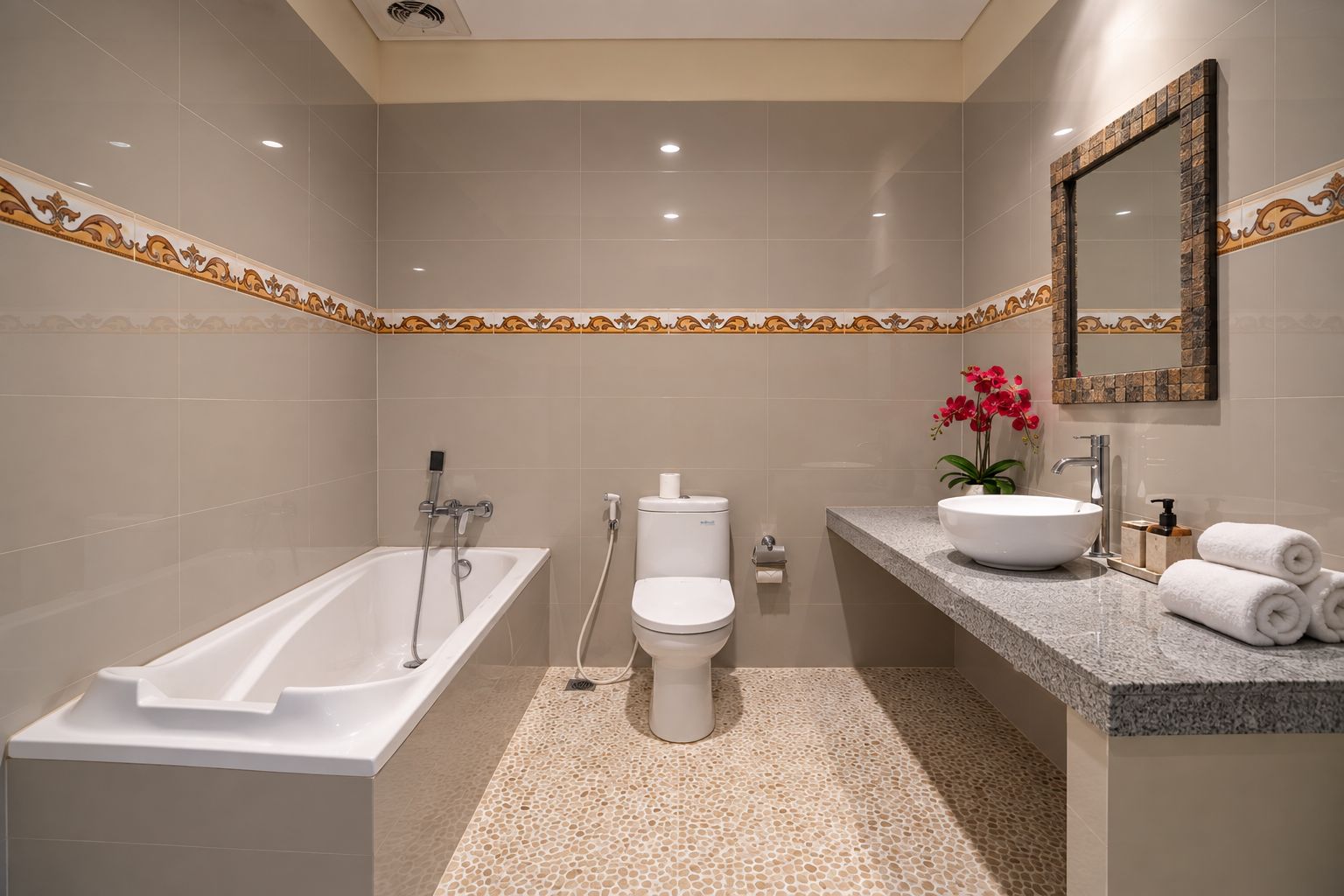 Un baño moderno con bañera, inodoro y lavabo.