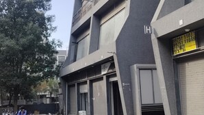 A modern building with a prominent 'HOTEL PARIS' sign. - Hotel Paris Plaza (Ahmedabad)