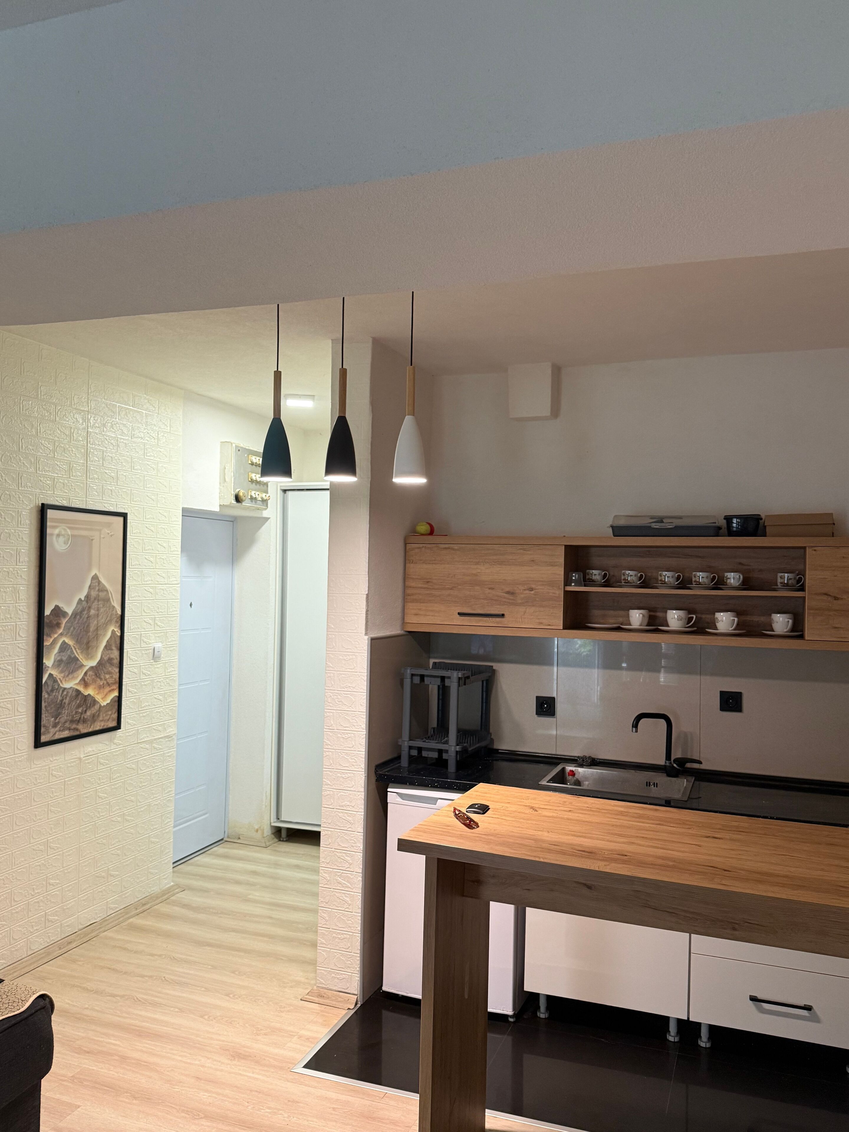 Fridge, microwave, cookware/dishes/utensils, dining table