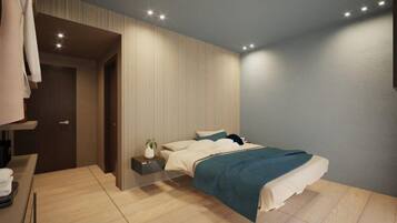 A modern bedroom with a bed, bedside table, and a small plant.