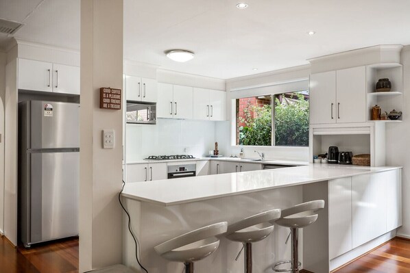 Microwave, dishwasher, highchair, dining tables