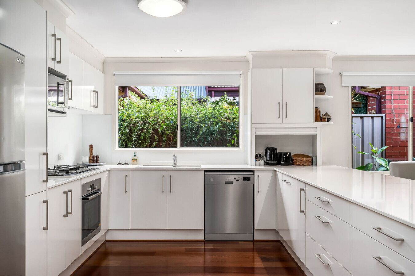 Microwave, dishwasher, high chair, dining tables