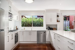 Microwave, dishwasher, high chair, dining tables