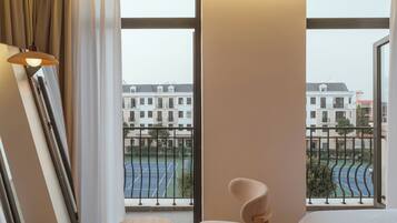 Deluxe Room, Balcony | In-room safe, individually furnished, desk, blackout drapes