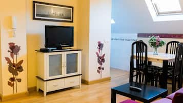 Family Penthouse | Living area | 22-inch TV with cable channels