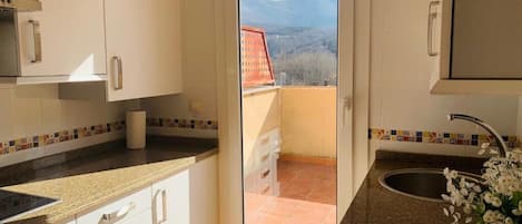 Studio, Balcony, Mountain View | Private kitchen | Mini-fridge, microwave, stovetop, cookware/dishes/utensils