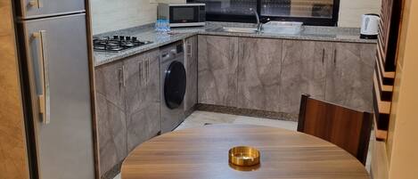 Microwave, stovetop, coffee/tea maker, cookware/dishes/utensils