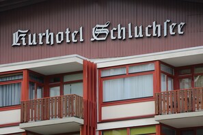 A hotel sign with the name 'Kurhotel Schluchsee'.