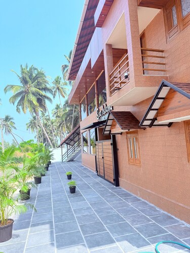 Sea island resort near Pulimut beach with AC and balcony.
