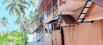 Sea island resort near Pulimut beach with AC and balcony.