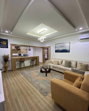 Family Apartment, Balcony, City View | Living area - Tiptop Apartment  (Abuja)