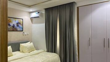 Family Apartment, Balcony, City View | 1 bedroom, desk, laptop workspace, blackout drapes