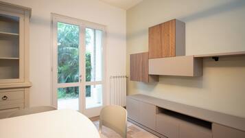 Family Villa, Garden View | Living area | Flat-screen TV