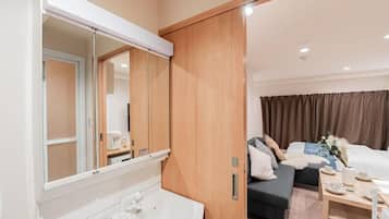 Standard Apartment, Multiple Beds, City View | Bathroom | Shower, rainfall showerhead, designer toiletries, hair dryer
