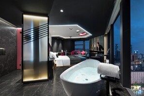 A modern hotel room with a large bathtub, a city view, and a bed with a cityscape view. - Beso Black Vinyl Fragment Hotel (Chengdu)