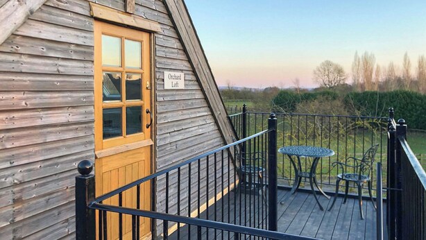 A wooden building with a sign reading "Orchard Loft." - 1 bedroom accommodation in near Uppingham (near Uppingham)