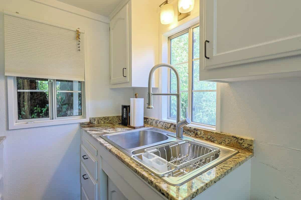 Fridge, microwave, coffee/tea maker, cookware/dishes/utensils