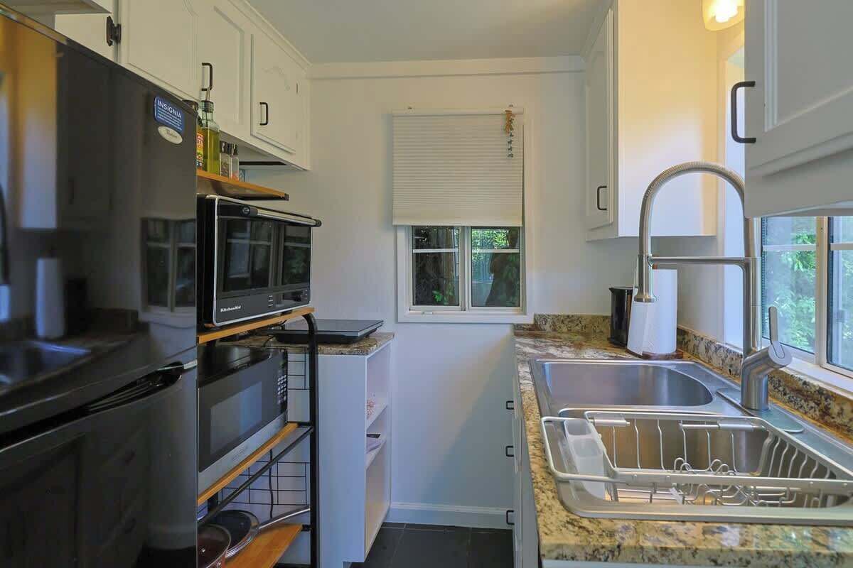 Fridge, microwave, coffee/tea maker, cookware/dishes/utensils