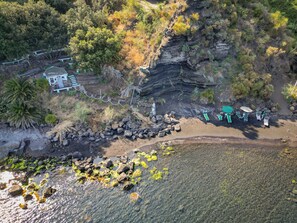 Private beach, black sand, free beach shuttle, sun-loungers
