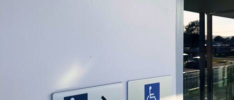 A sign indicating accessible entrance and room 5.