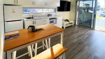 Standard Cabin | Private kitchen | Full-size fridge, microwave, toaster, cookware/dishes/utensils