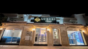 A luxury hotel entrance with a sign reading "LUXURY Chateau." - LUXURY CHAOUEN (Chefchaouen)