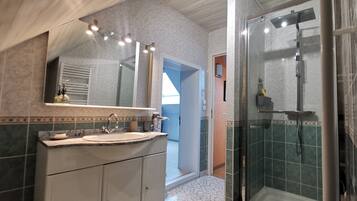 Shower, hair dryer, towels, soap