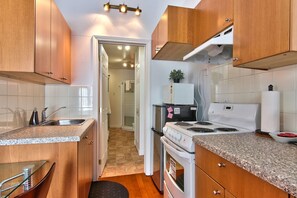 Fridge, stovetop, toaster, cookware/dishes/utensils
