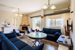 TV, fireplace - GrandVillle Cottage Escape, w/ Breathtaking Views (Galataki)