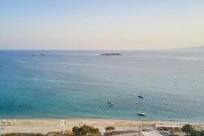 On the beach, sun-loungers, beach umbrellas, beach towels