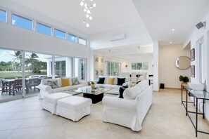 Deluxe Villa, Patio, Lake View | Living area | 55-inch plasma TV with cable channels