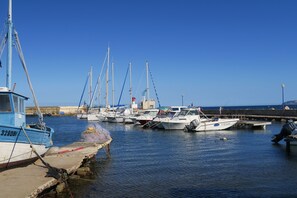 Boats docked at the marina, offering a serene waterfront scene.