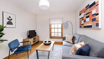 Apartamento conforto, vista para a cidade | Área de estar