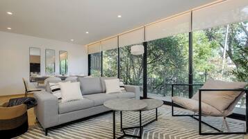 Apartment, Balcony, City View | Living area | 27-inch flat-screen TV with digital channels