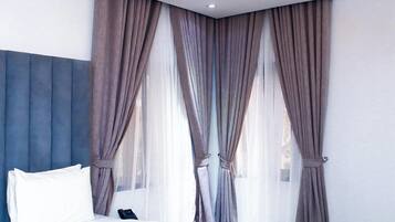 Deluxe Apartment, Balcony, City View | 1 bedroom, desk, laptop workspace, blackout drapes