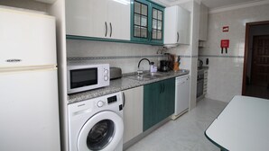 Apartamento, vista para a cidade | Cozinha privada