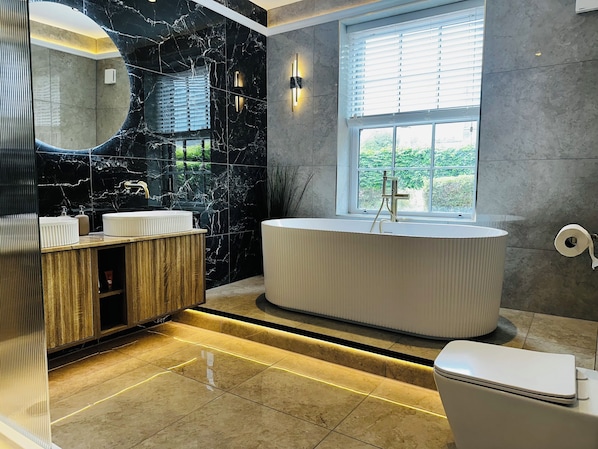Shower, hair dryer, towels, soap