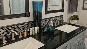 A bathroom with two sinks, a large mirror, and a tiled backsplash. - #1. Peaceful Private Room Near FLL Airport (Sunrise)