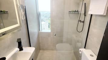 Deluxe Double Room, Mountain View | Bathroom | Shower, designer toiletries, hair dryer, slippers
