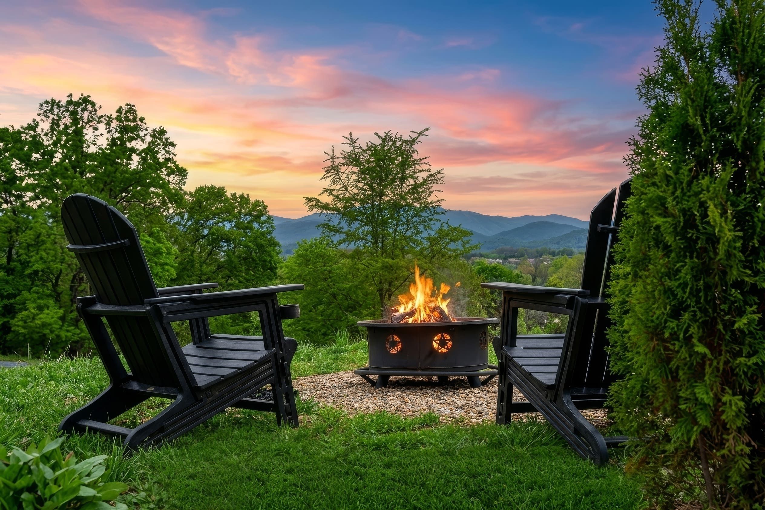 Two Adirondack chairs facing a fire pit with a mountain view.