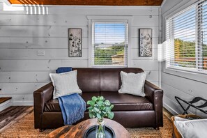 Family Cabin, Mountain View | Living area | 32-inch Smart TV with digital channels, fireplace, books - Sojourn Lodging (Sevierville)