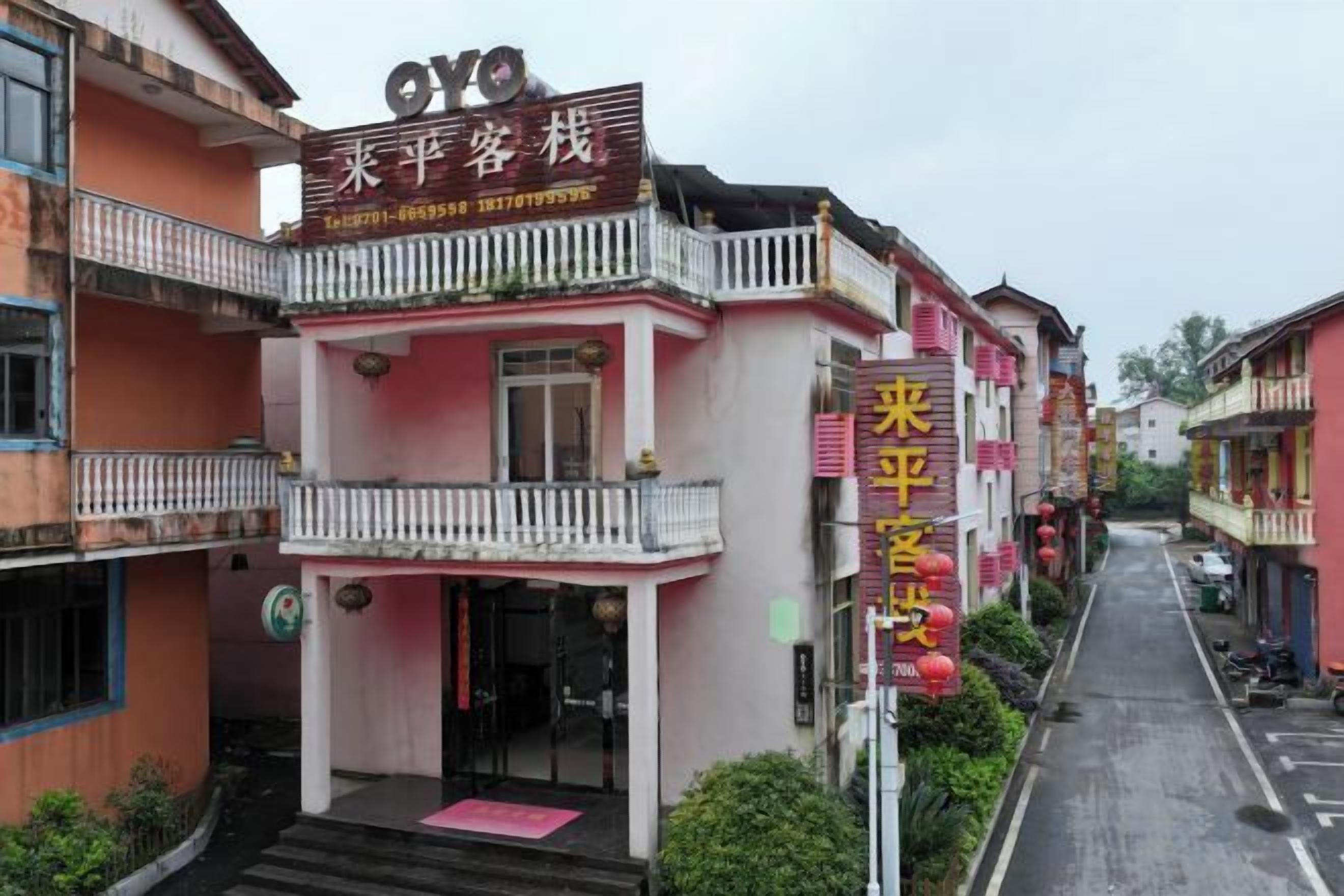 A two-story building with a balcony on the upper floor.