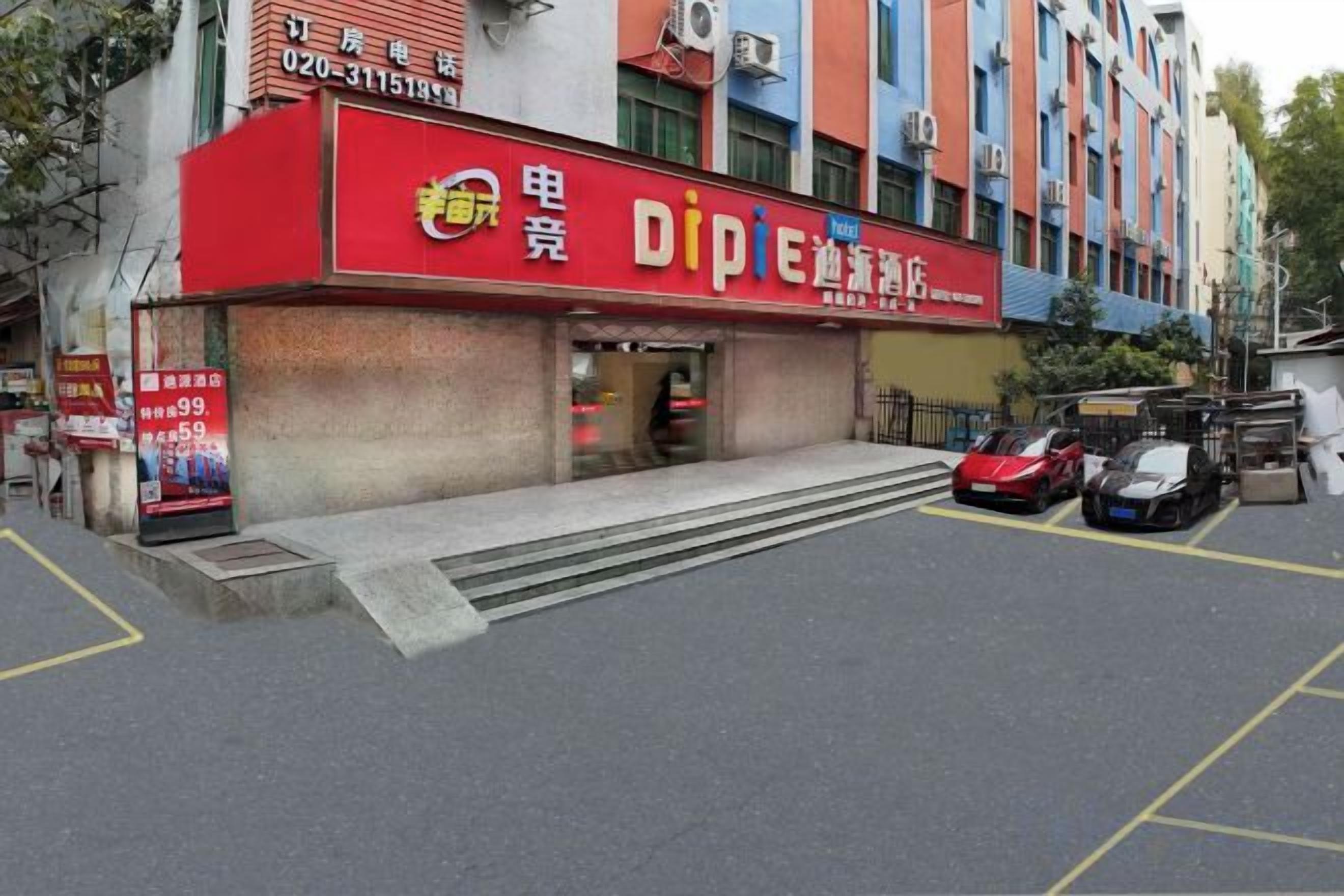 Edifício com fachada vermelha identificada por 'DIPIE' e estacionamento com vários carros.